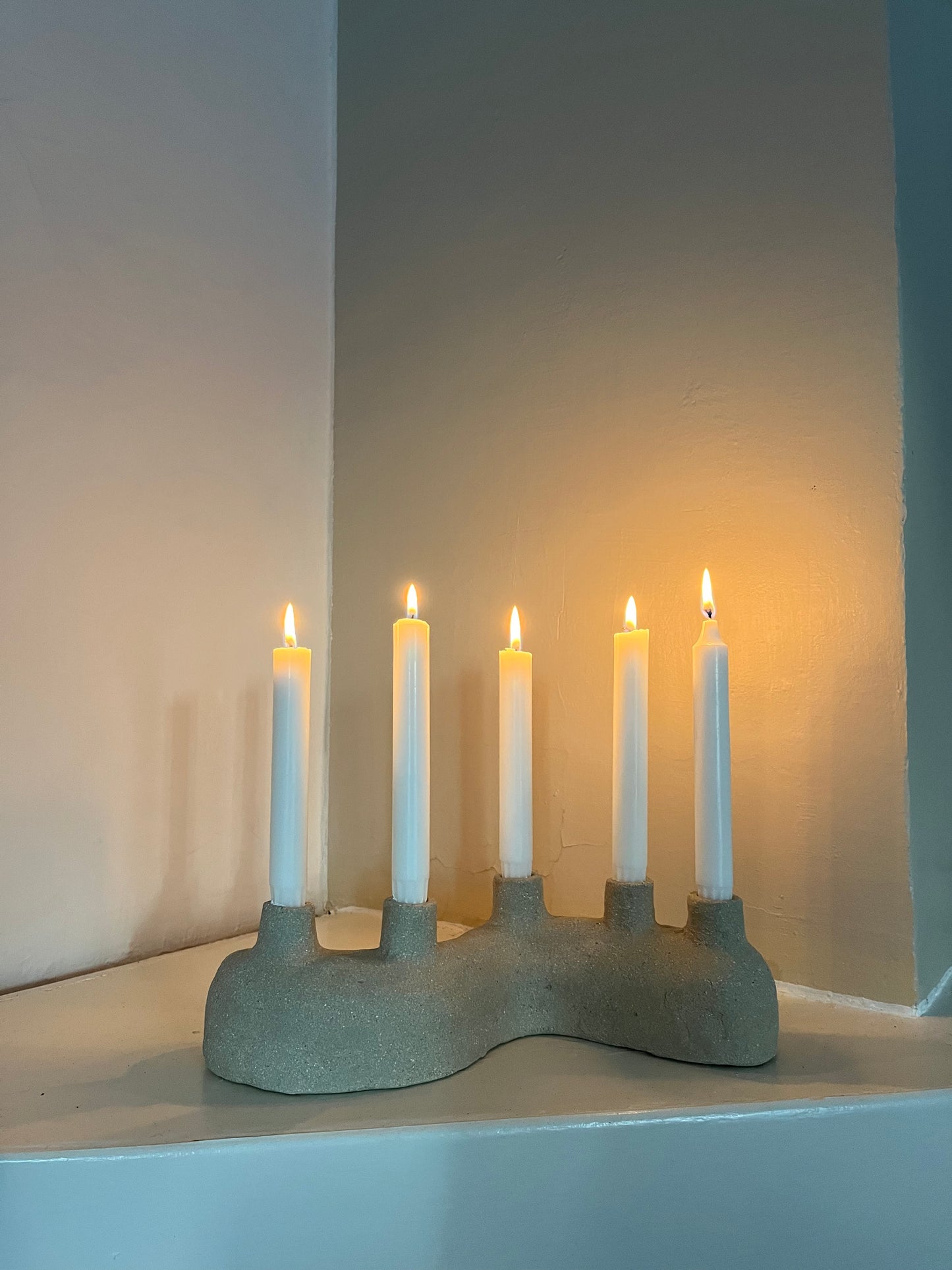 Curved candle holder