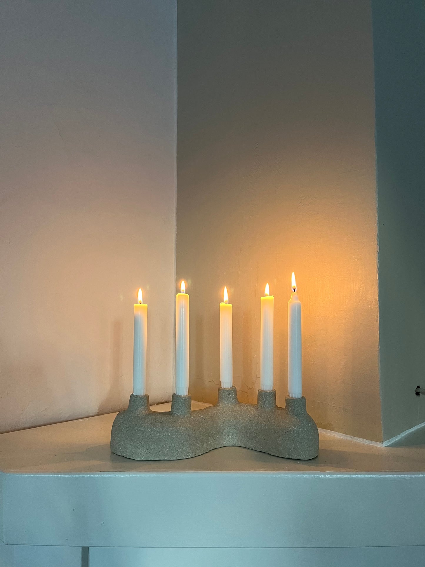 Curved candle holder