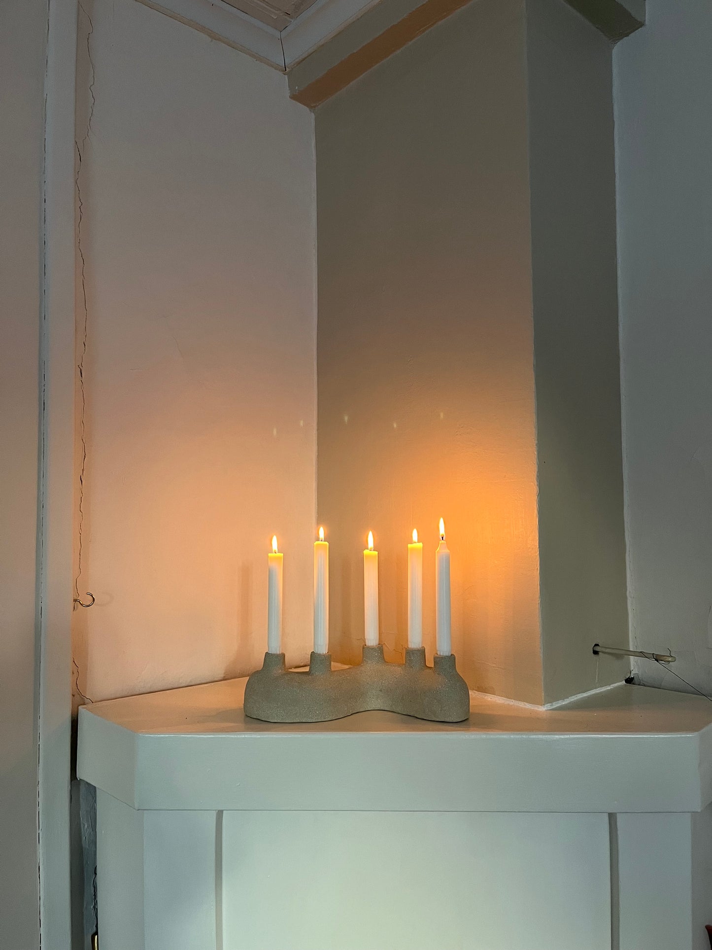 Curved candle holder